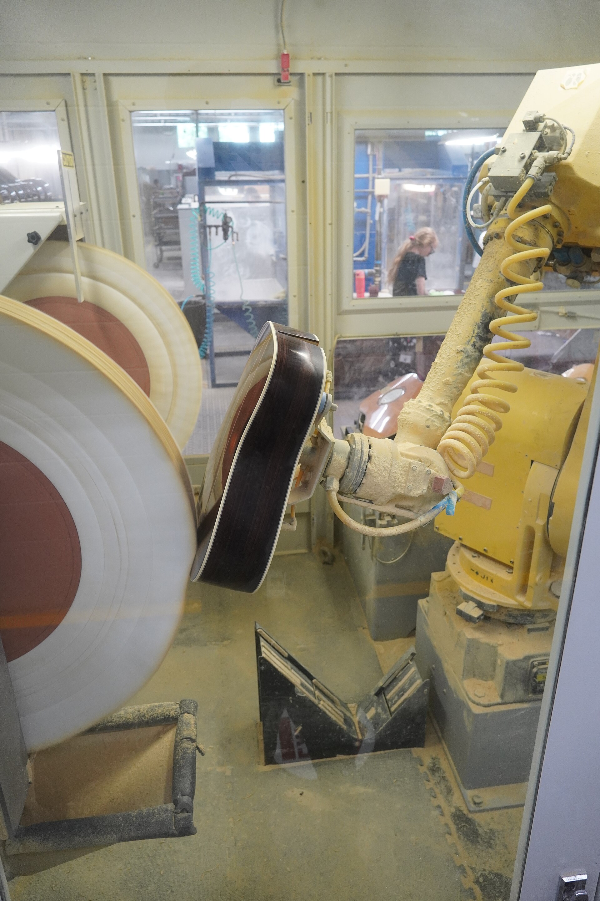 An industrial robotic arm at work in a factory