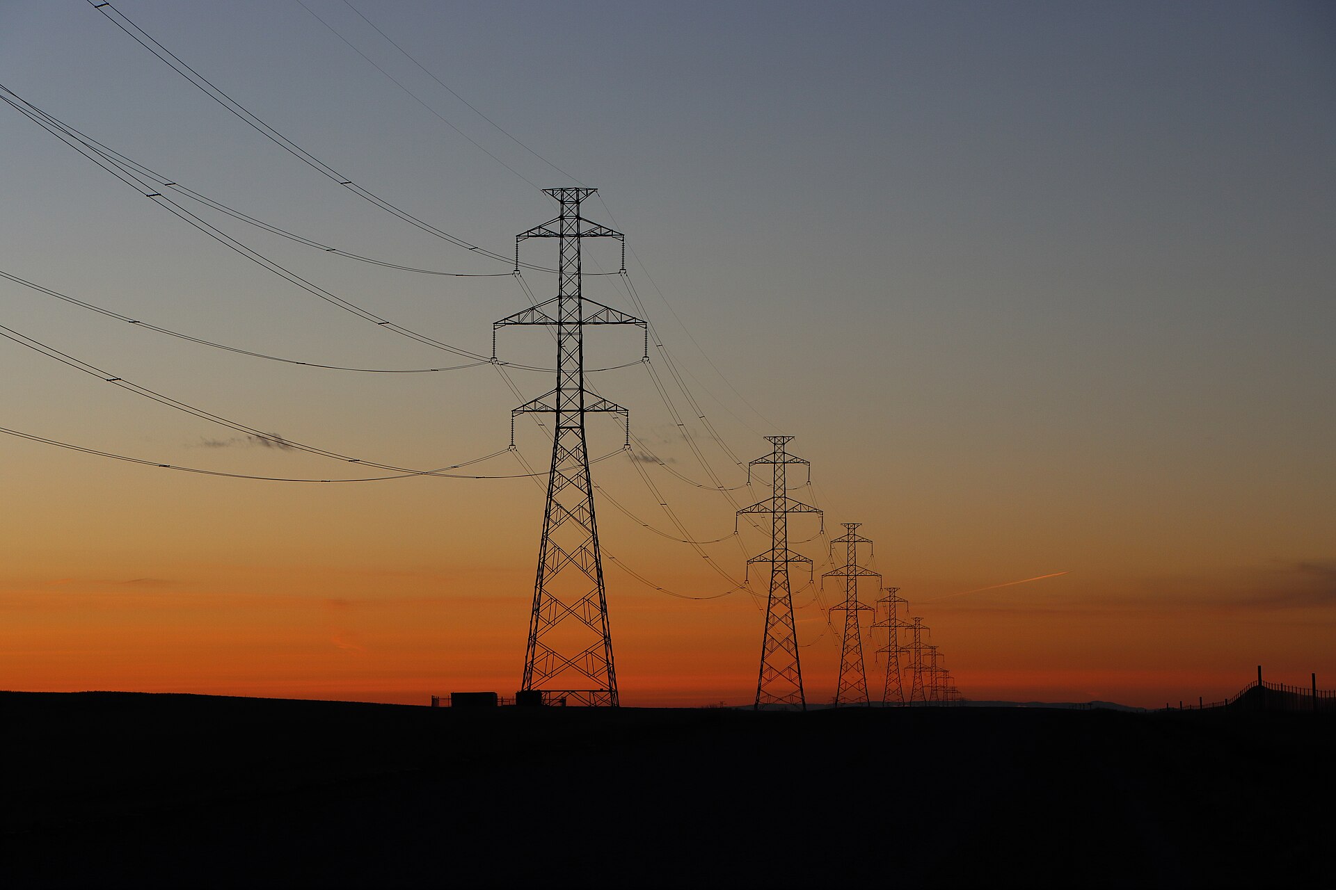 Electrical power transmission lines at dusk